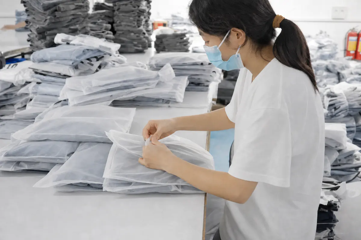 Finished denim garments being packed for shipment