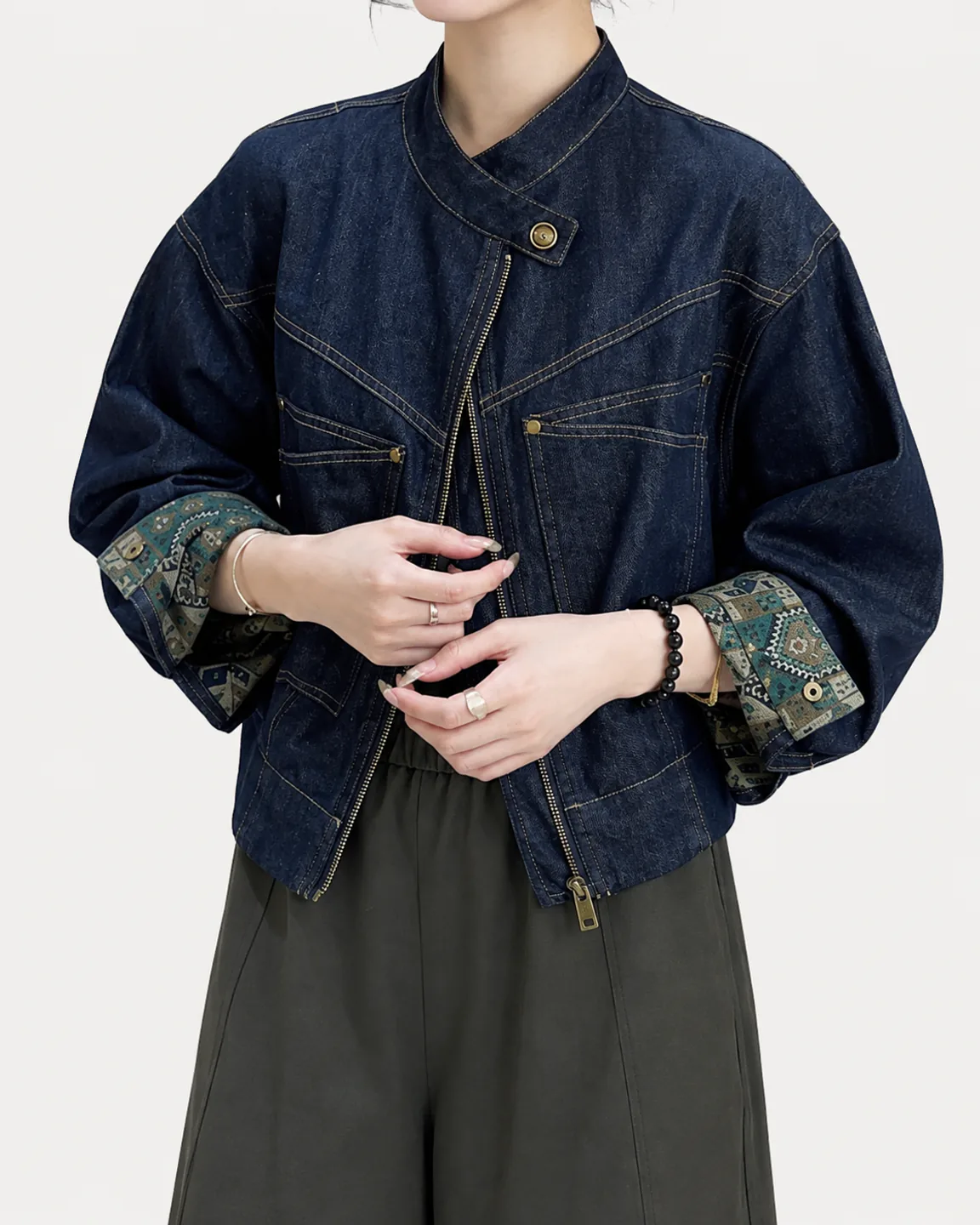 Women’s dark indigo asymmetric zip denim jacket with contrast patterned cuffs