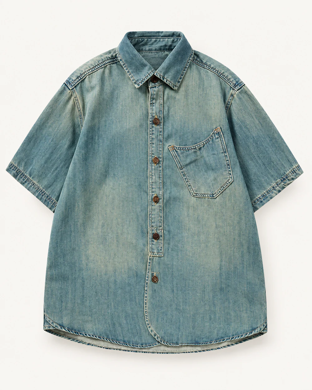 Light wash short-sleeve denim shirt with asymmetric patch pocket and curved hem
