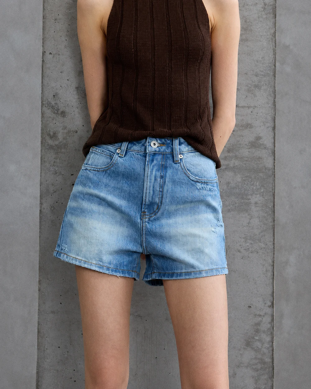 Women's light-wash relaxed denim shorts with a high rise and wide leg