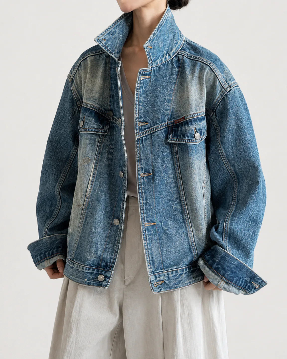 Women’s vintage-wash oversized denim trucker jacket with double chest pockets