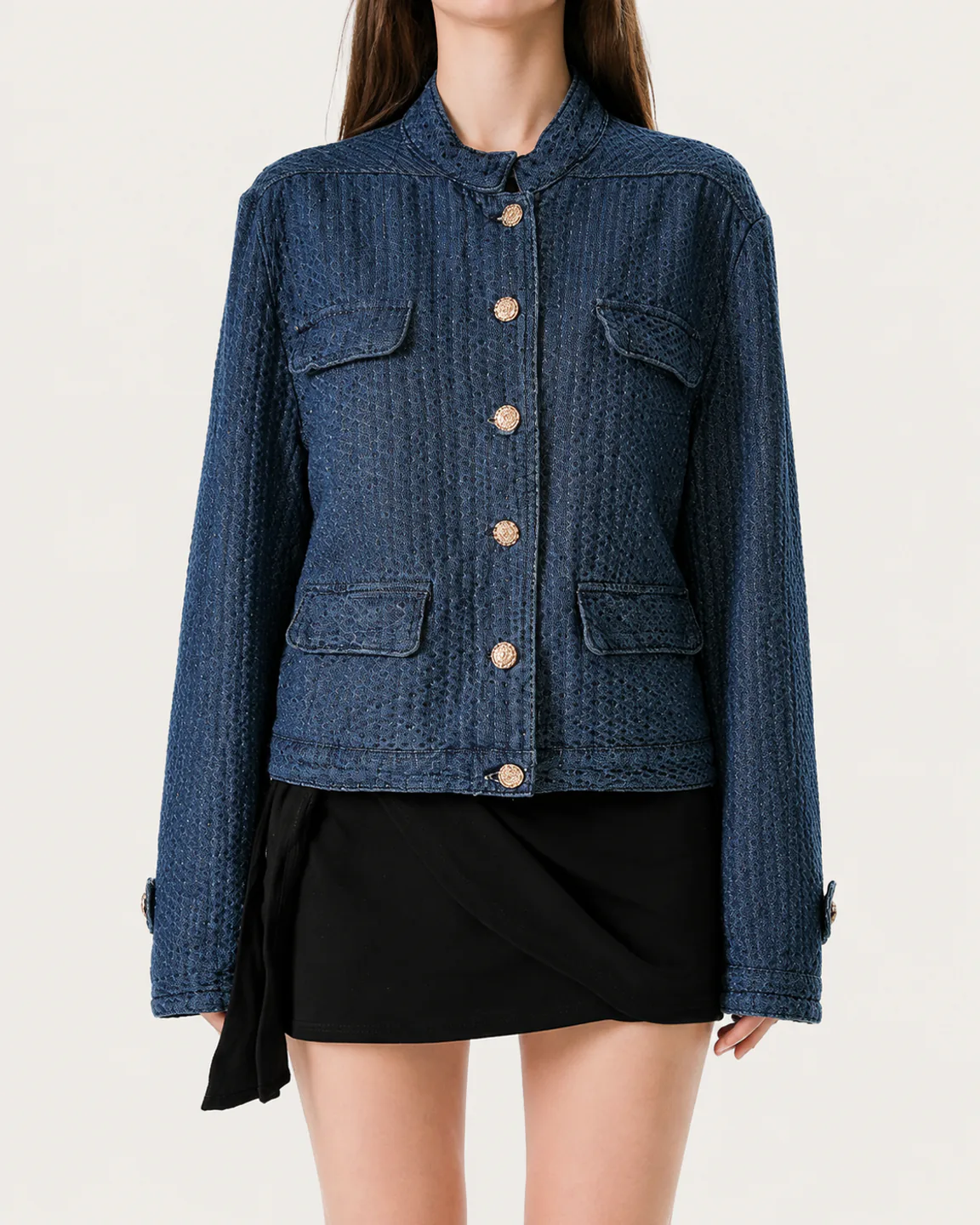 Women’s dark indigo textured denim jacket with gold buttons and four patch pockets