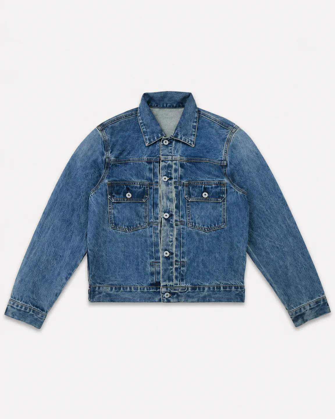 Classic mid-wash denim trucker jacket with two button-flap chest pockets