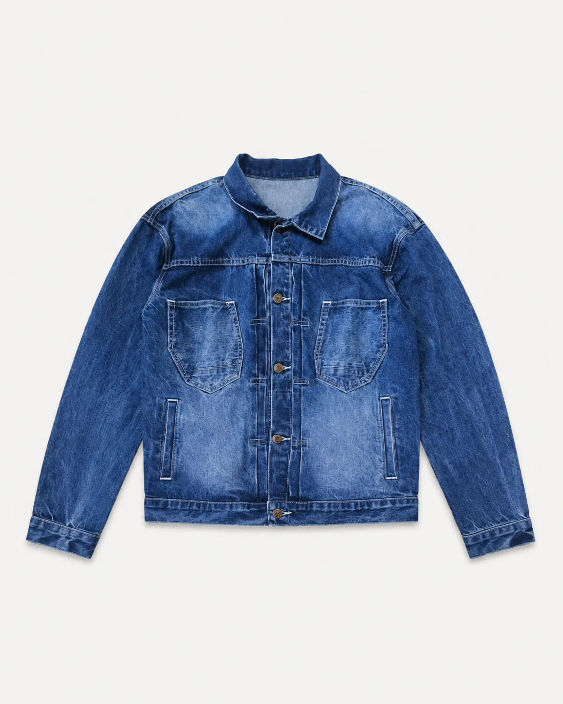 Vintage-wash blue denim jacket with large chest pockets and lower welt pockets
