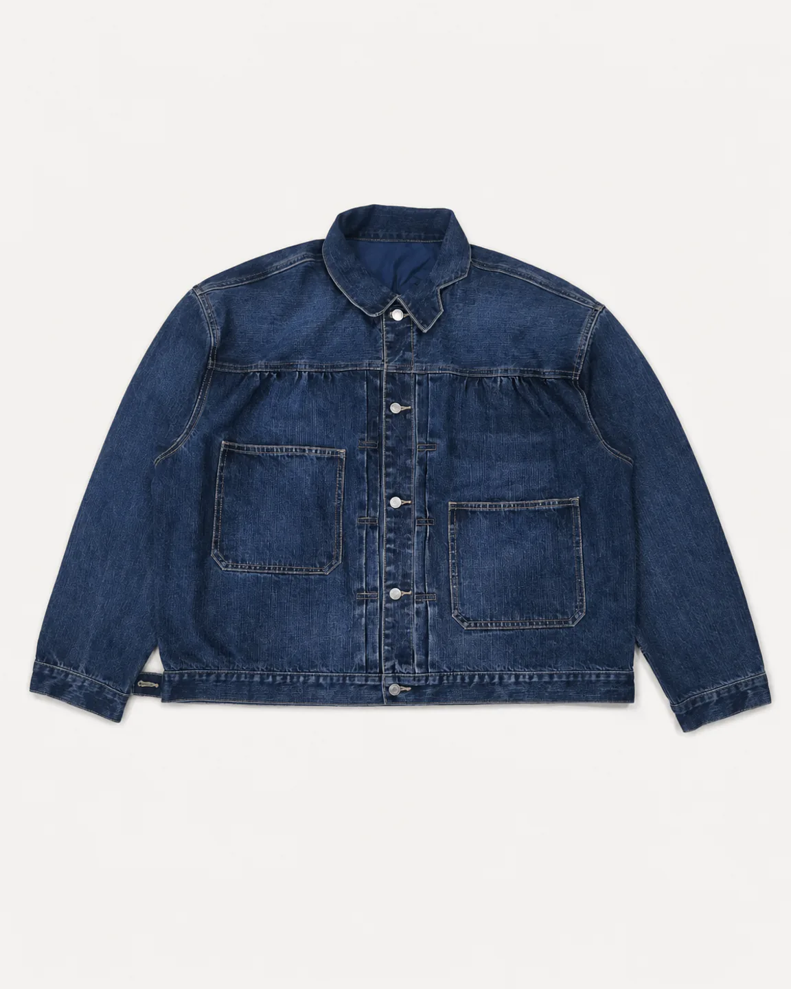 Oversized indigo denim chore jacket with two large patch pockets