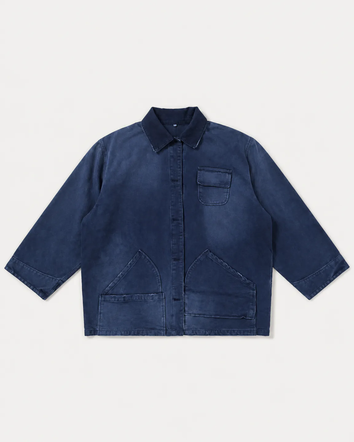 Deep-blue garment-dyed denim chore jacket with angled utility pockets