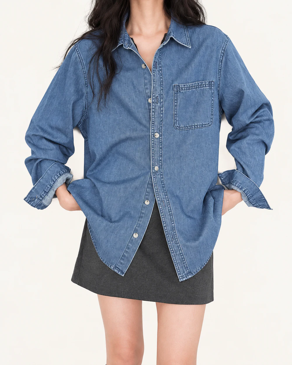 Relaxed one-pocket denim shirt with turned cuffs and curved hem