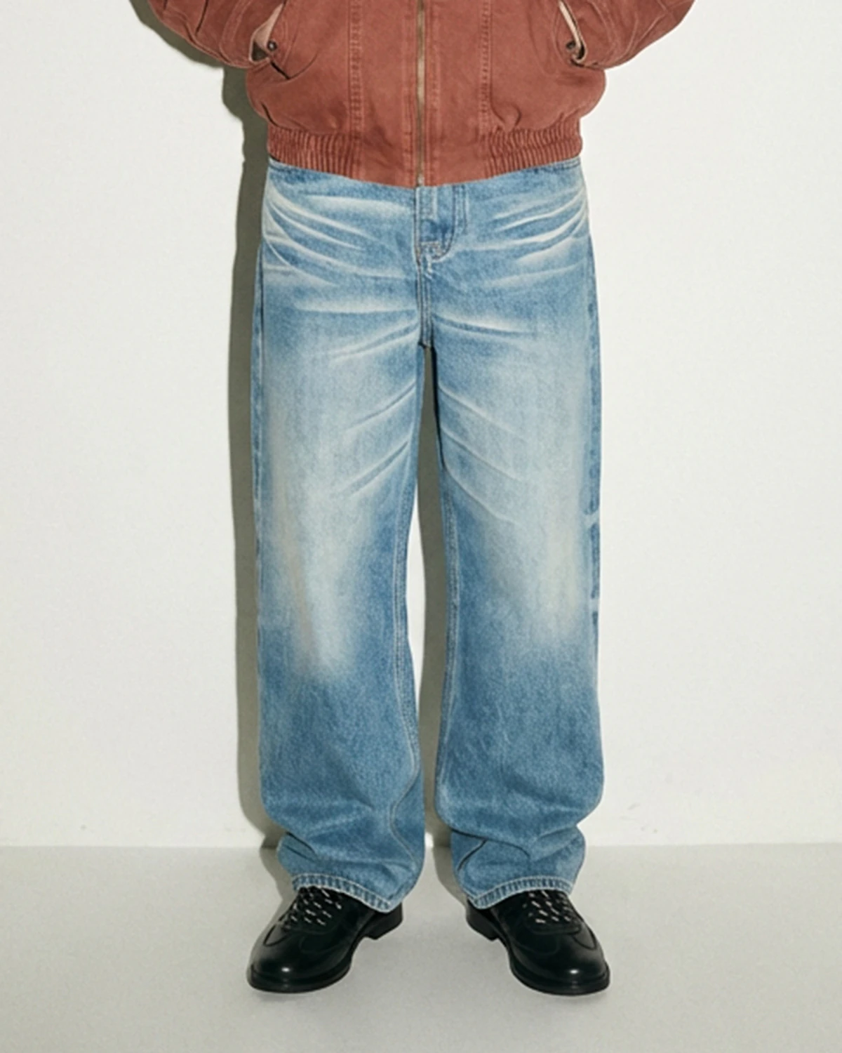 Men’s light-wash baggy jeans with vintage whisker fading
