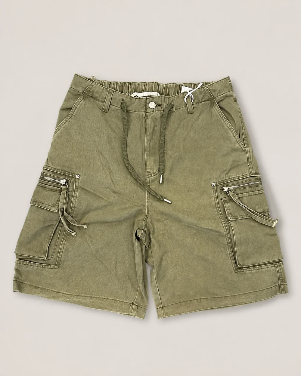 Olive garment-dyed utility cargo shorts with zip pockets and a drawcord waist