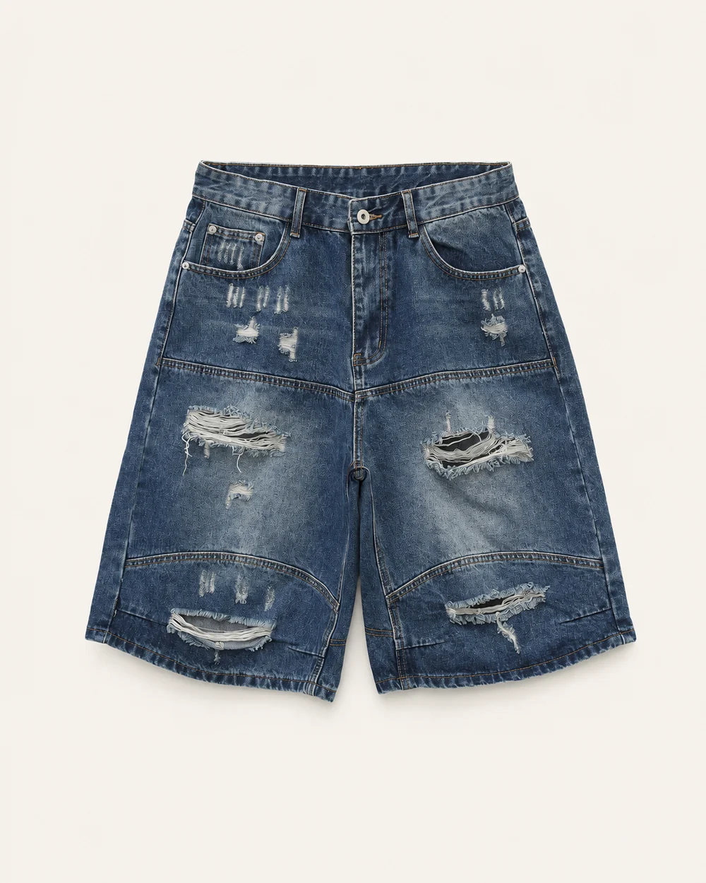 Vintage-wash oversized denim jorts with ripped details curved panel seams and a wide leg