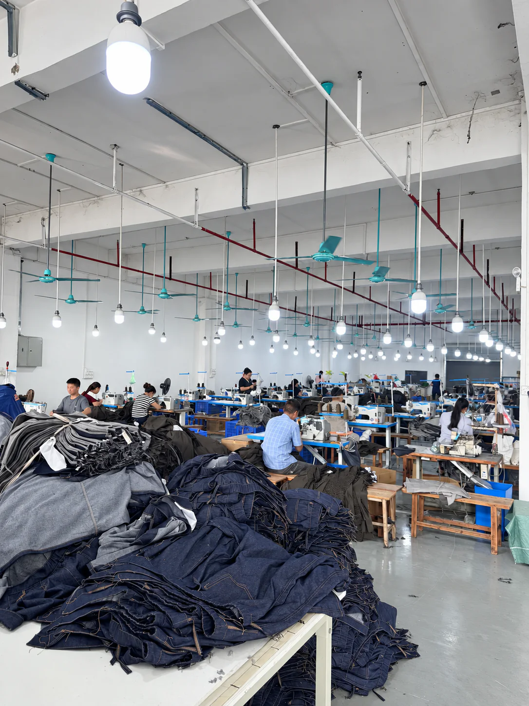 Beilin Denim sewing floor with workers assembling denim garments
