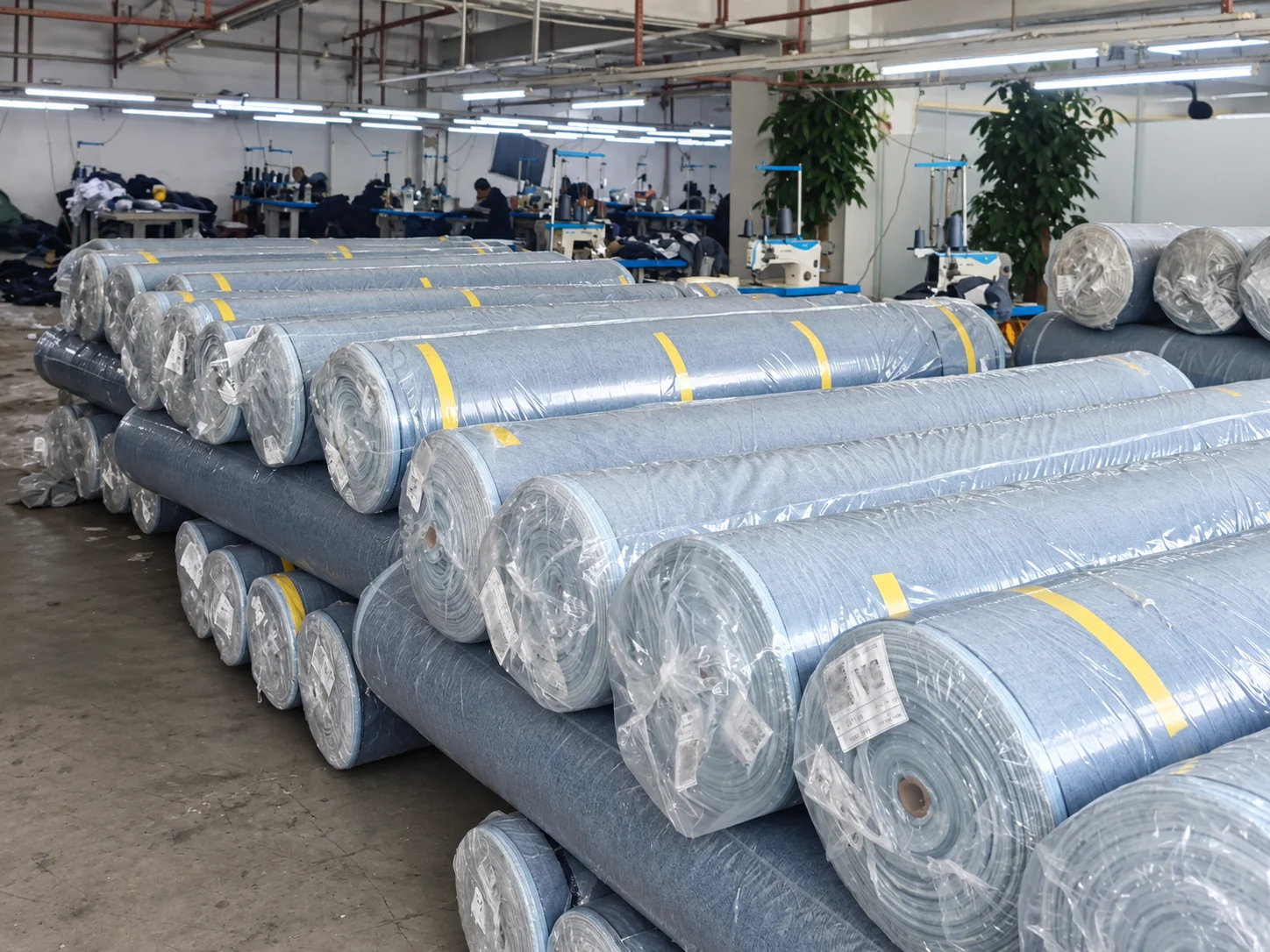 Rolls of denim fabric prepared and labeled for bulk production