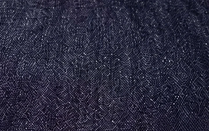 Dark indigo crosshatch denim reference with intersecting yarn character