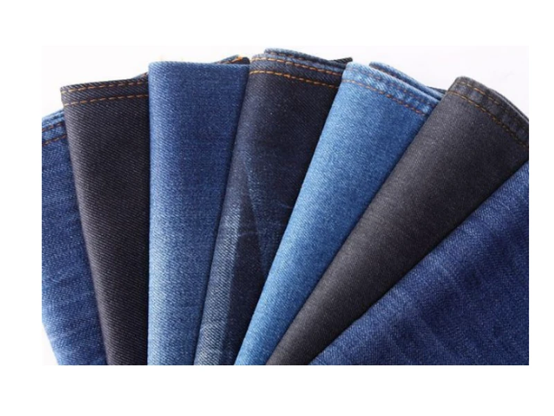 Denim fabric swatches in different indigo shades and finishes